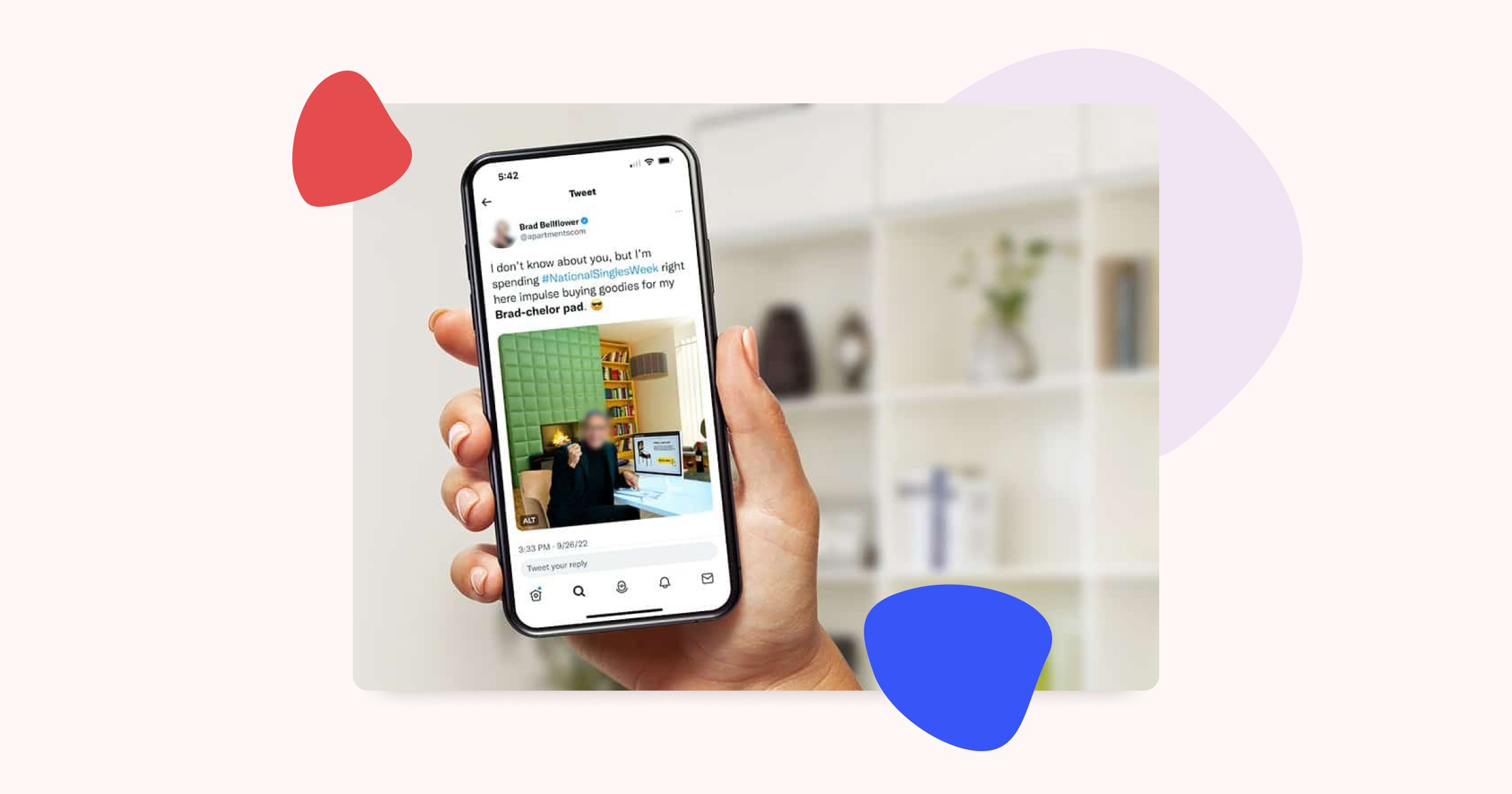 A photograph of a hand holding a phone, the phone has the Twitter application open with a tweet by Brad Bellflower that says I don't know about you, but I am spending #NationalSinglesWeek right here impulse buying goodies for my Brad-chelor Pad.